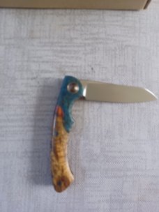 Johan Ellis Springbok...4",Karilian Bolsters..Amboyna scales...G10 and titanium frame.Rwl34..coa 