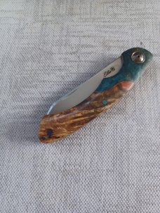 Johan Ellis Springbok...4",Karilian Bolsters..Amboyna scales...G10 and titanium frame.Rwl34..coa 