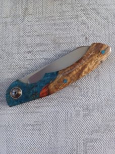 Johan Ellis Springbok...4",Karilian Bolsters..Amboyna scales...G10 and titanium frame.Rwl34..coa 