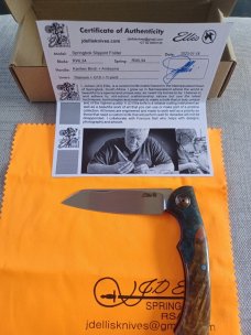 Johan Ellis Springbok...4",Karilian Bolsters..Amboyna scales...G10 and titanium frame.Rwl34..coa 