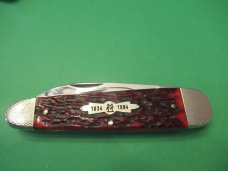 Kissing Crane 150th Anniversary Red Jigged Bone Sleeveboard Whittler 1834 to 1984