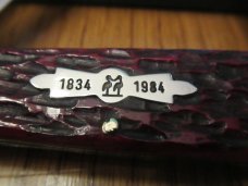Kissing Crane 150th Anniversary Red Jigged Bone Sleeveboard Whittler 1834 to 1984