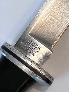 Buck 102 with Sheath.  3 Line Stamp. Light handling and use. 