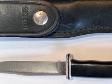 Buck 102 with Sheath.  3 Line Stamp. Light handling and use. 