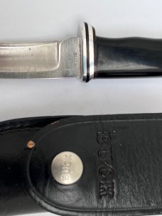 Buck 121, inverted 3 line stamp, with correct sheath. Excellent Condition, 5 5/8" blade length