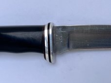 Buck 121, inverted 3 line stamp, with correct sheath. Excellent Condition, 5 5/8" blade length