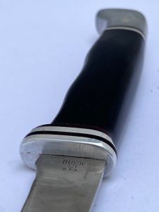 Buck 121, inverted 3 line stamp, with correct sheath. Excellent Condition, 5 5/8" blade length