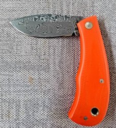 Jeff Pearce Medium Nessie Ultralight..3.5 " closed..Damasteel blade and backspring..Orange G10..coa