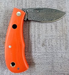 Jeff Pearce Medium Nessie Ultralight..3.5 " closed..Damasteel blade and backspring..Orange G10..coa