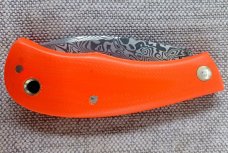 Jeff Pearce Medium Nessie Ultralight..3.5 " closed..Damasteel blade and backspring..Orange G10..coa