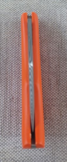 Jeff Pearce Medium Nessie Ultralight..3.5 " closed..Damasteel blade and backspring..Orange G10..coa