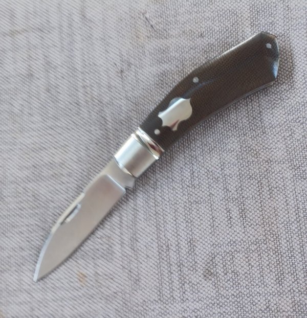 Cosimo Benedetto Dino Slipjoint...Fluted bolsters.. Rwl34..3.75 closed...Canvas MIcarta..coa & slip 