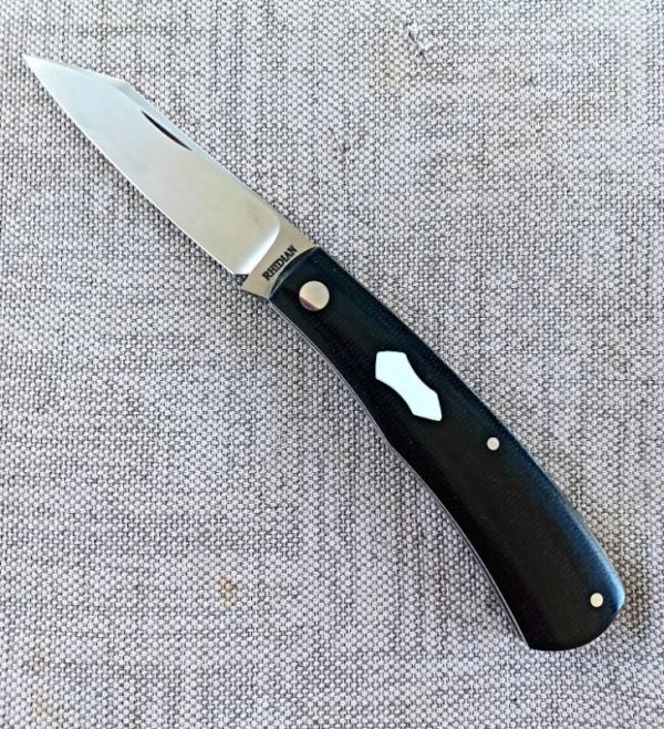 Rhidian Shadow Native...Black Linen micarta. .Cpm154..4" cld..white liners and white Shield.. coa