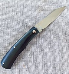 Rhidian Shadow Native...Black Linen micarta. .Cpm154..4" cld..white liners and white Shield.. coa