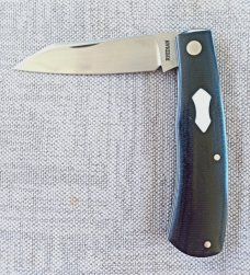 Rhidian Shadow Native...Black Linen micarta. .Cpm154..4" cld..white liners and white Shield.. coa