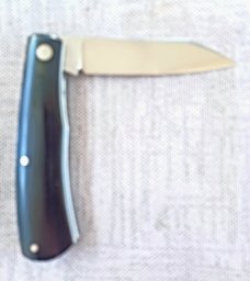 Rhidian Shadow Native...Black Linen micarta. .Cpm154..4" cld..white liners and white Shield.. coa