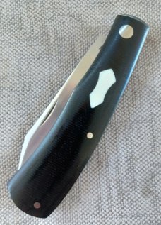 Rhidian Shadow Native...Black Linen micarta. .Cpm154..4" cld..white liners and white Shield.. coa