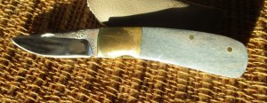 Jay Bigler “98” folding knife, blue with brass handle