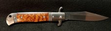 Original CZ Czech Hidden Release knife in rare Snakewood handles.