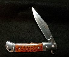 Original CZ Czech Hidden Release knife in rare Snakewood handles.