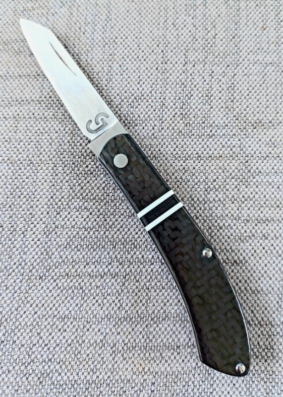 Grayson Jennings Raptor..Carbon fiber Shadow..White liners and accents..CpmS35Sv...3.5 closed..coa