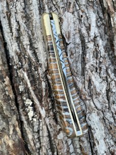 BUCK 110 LEROY REMER CUSTOM BROWN MAMMOTH TOOTH FOLDING HUNTER