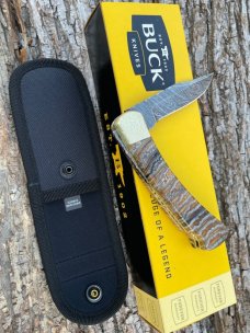 BUCK 110 LEROY REMER CUSTOM BROWN MAMMOTH TOOTH FOLDING HUNTER