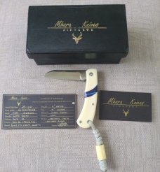Mhara Native.,N690,..4".coa& box,..Blue G10 inlays....Full Hippo Ivory Scales..lanyard w/ivory bead