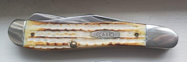 Roman Numeral stamp SC6240 dogleg trapper, Second Cut Burnt White Bone Handles