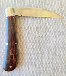 K'roo Desert Ironwood Swayback..Rwl34...3.75" closed...filework..fluted..red liners..coa and slip