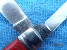 Utica (arch) Cutlery Co Utica NY Red Swirl Barehead Jack