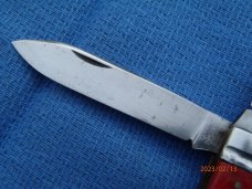 Utica (arch) Cutlery Co Utica NY Red Swirl Barehead Jack