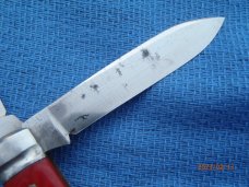 Utica (arch) Cutlery Co Utica NY Red Swirl Barehead Jack