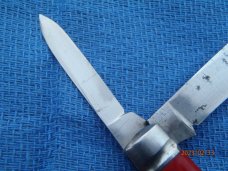 Utica (arch) Cutlery Co Utica NY Red Swirl Barehead Jack