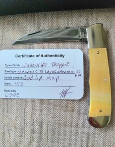 Jeff Pearce Gold lip and GoMai Wharncliffe Trapper...31 layer stainless Blade...4" closed..coa.pouch
