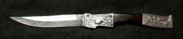 RPK Hand engraved bolsters and blade. RPK Hand engraved bolsters and blade.