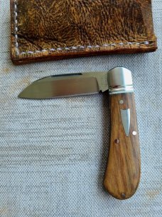 Robbie Ferreira African Stinkwood Zulu...N690..3.75" closed..fluted bolsters ..African Leather slip