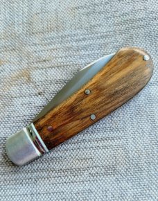 Robbie Ferreira African Stinkwood Zulu...N690..3.75" closed..fluted bolsters ..African Leather slip