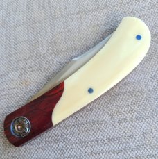 Johan Ellis Igwe.Lanny..4",Warthog Tusk Ivory with Karellian bols ...G10 and titanium frame...Rwl34 