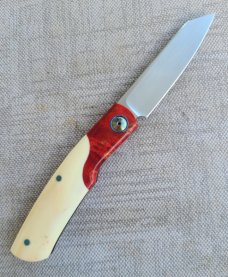 Johan Ellis Gunstock..4",Warthog Tusk Ivory with Karellian bols ...G10 and titanium frame...Rwl34 