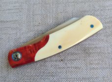 Johan Ellis Gunstock..4",Warthog Tusk Ivory with Karellian bols ...G10 and titanium frame...Rwl34 