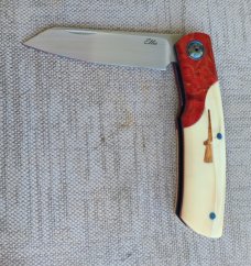 Johan Ellis Gunstock..4",Warthog Tusk Ivory with Karellian bols ...G10 and titanium frame...Rwl34 