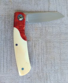 Johan Ellis Gunstock..4",Warthog Tusk Ivory with Karellian bols ...G10 and titanium frame...Rwl34 