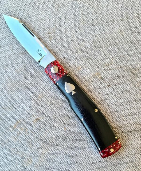 K'roo Native..Red Ctec Bolsters&Caps..Black Linen Micarta scales...Rwl34...Ace of Spades Shield..4" K'roo Native..Red Ctec Bolsters&Caps..Black Linen Micarta scales...Rwl34...Ace of Spades Shield..4"