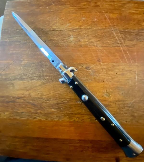 11 In. Italian Swivel Bolster,  Black Composition, Stainless Bayonet, SwitchBlade