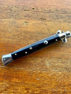 11 In. Italian Swivel Bolster,  Black Composition, Stainless Bayonet, SwitchBlade