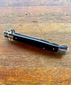 11 In. Italian Swivel Bolster,  Black Composition, Stainless Bayonet, SwitchBlade