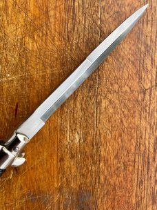 11 In. Italian Swivel Bolster,  Black Composition, Stainless Bayonet, SwitchBlade