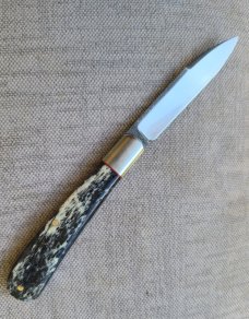 K'roo Black Kudu Bone Zulu...N690..3.75 closed..bolsters and shield..coa and slip 