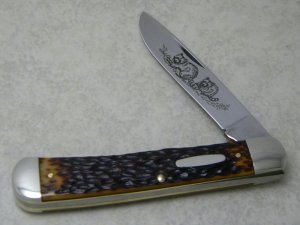 Western USA S-693 D Jigged Delrin Linerlock 1 Blade Trapper Knife with Raccoon Etch c.1980